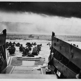 GI's landing in France from Coast Guard landing barge on June 6, 1944.