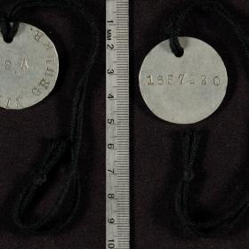 This identification tag has the inscription "James L. Davis PFC USA" and "1297407".