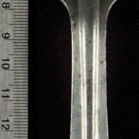 Metal fork has "US" stamped onto the top of the handle. On the reverse side is "WBW," the number "4134," and "1918."